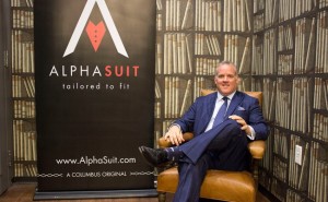 Sean McKee with Alphasuit Brand sign