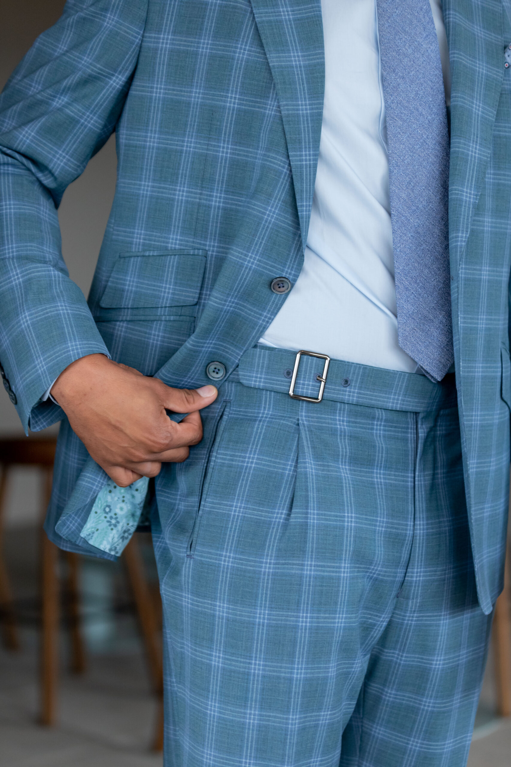 Spring Summer version of Super 130’s Wool Stretch custom made suit in a tropical weave Caribbean Blue Green Plaid color