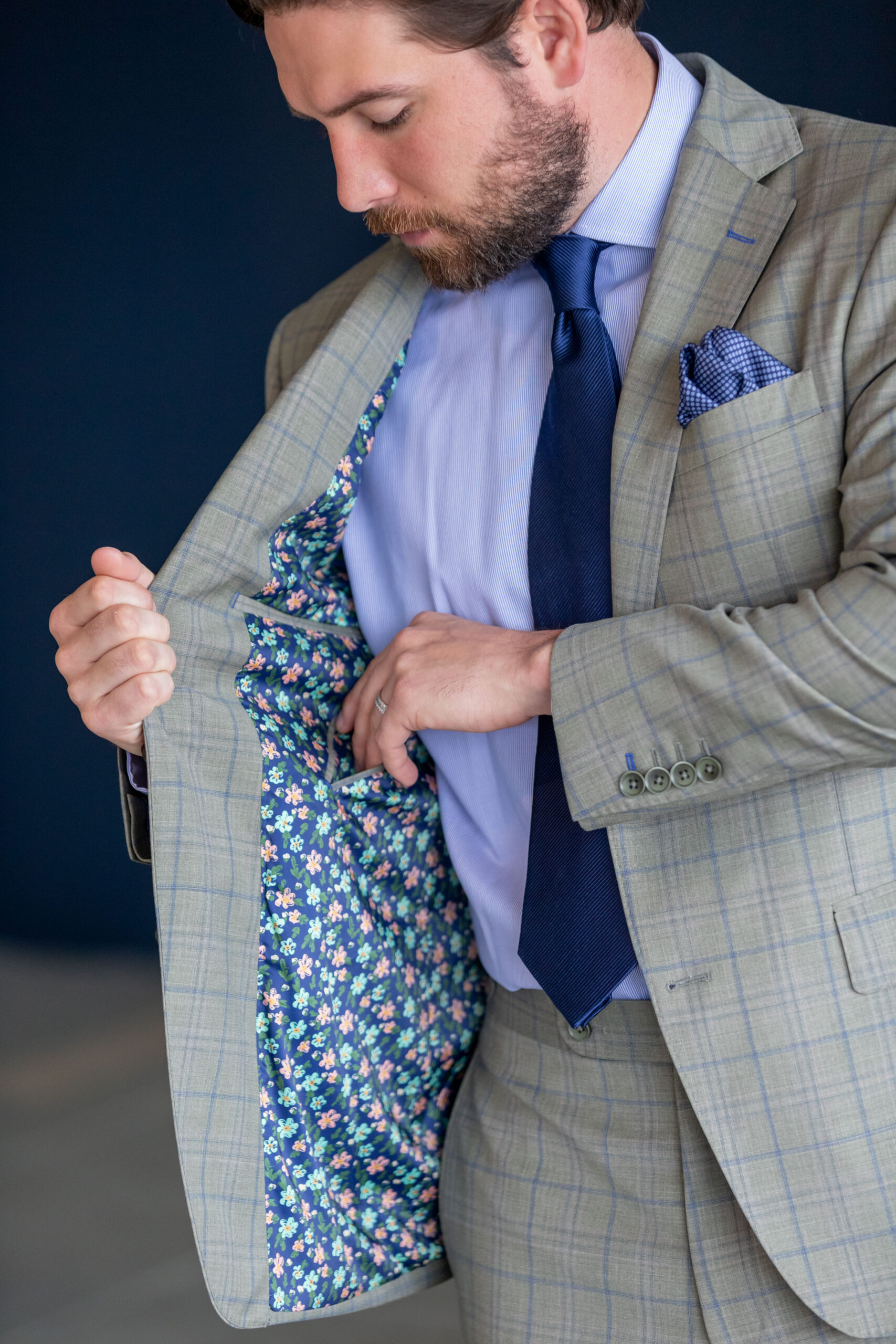 Spring Summer version of Super 130’s wool stretch custom made suit in a tropical weave light grey with blue plaid