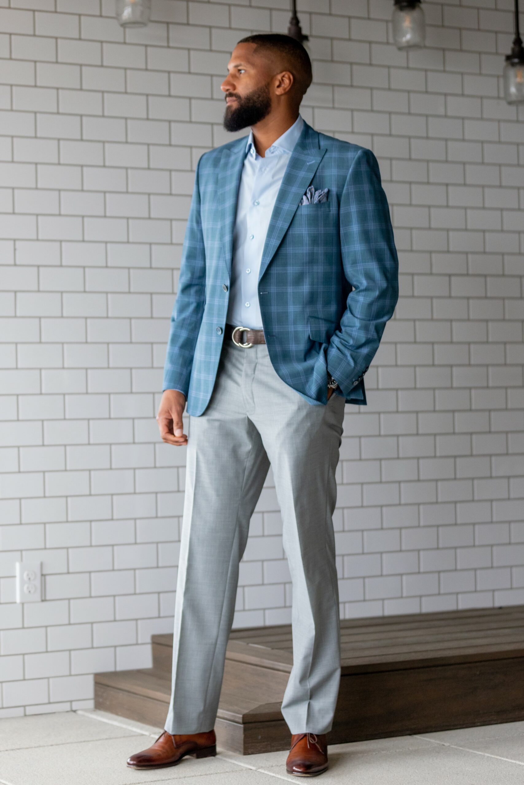 Spring Summer version of Super 130’s wool stretch custom made blue plaid sport coat and gray pants in a tropical weave