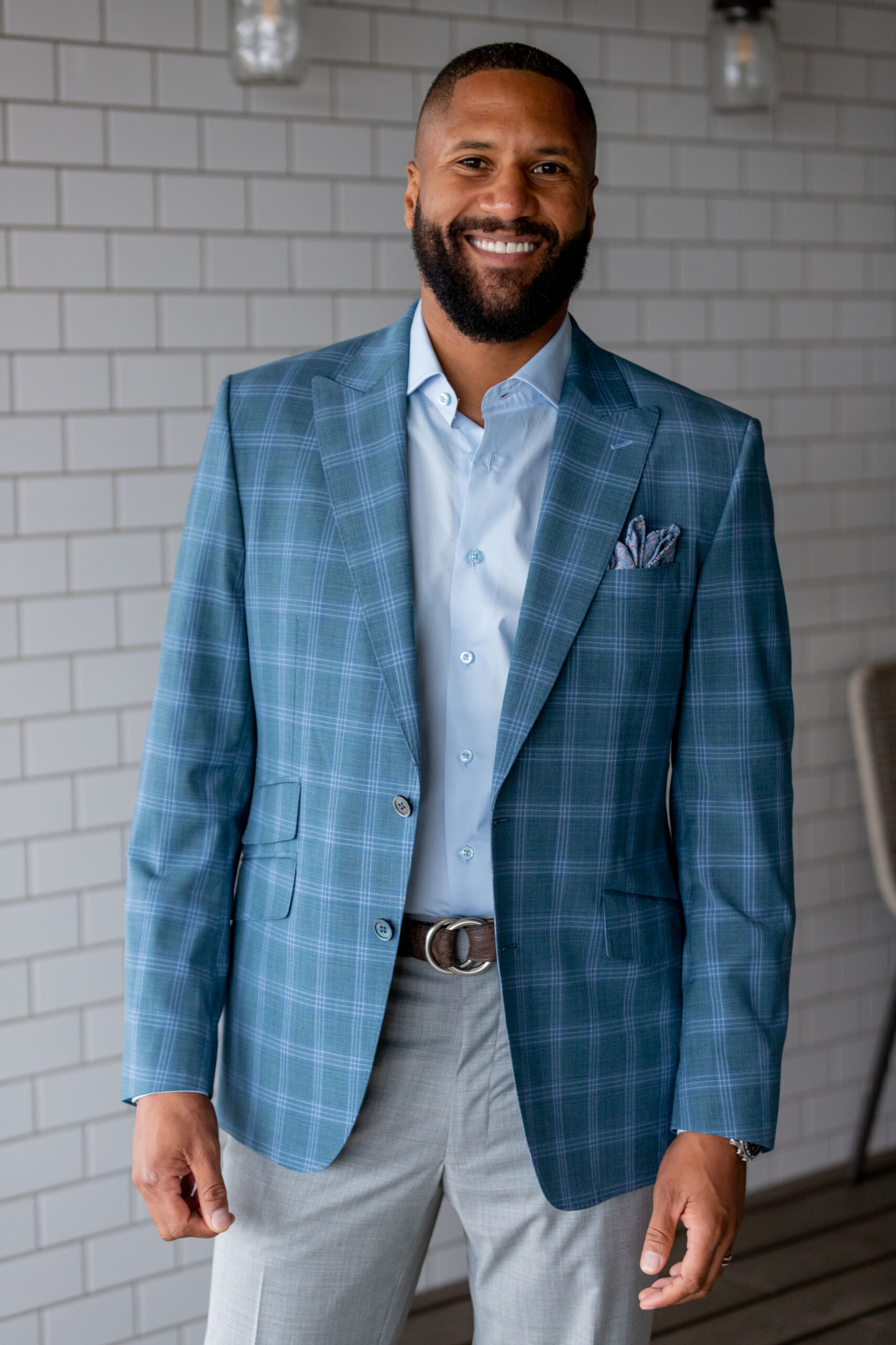 Spring Summer version of Super 130’s wool stretch custom made blue plaid sport coat and gray pants in a tropical weave